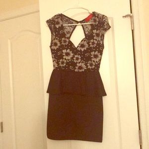Black open back peplum dress with lace detail